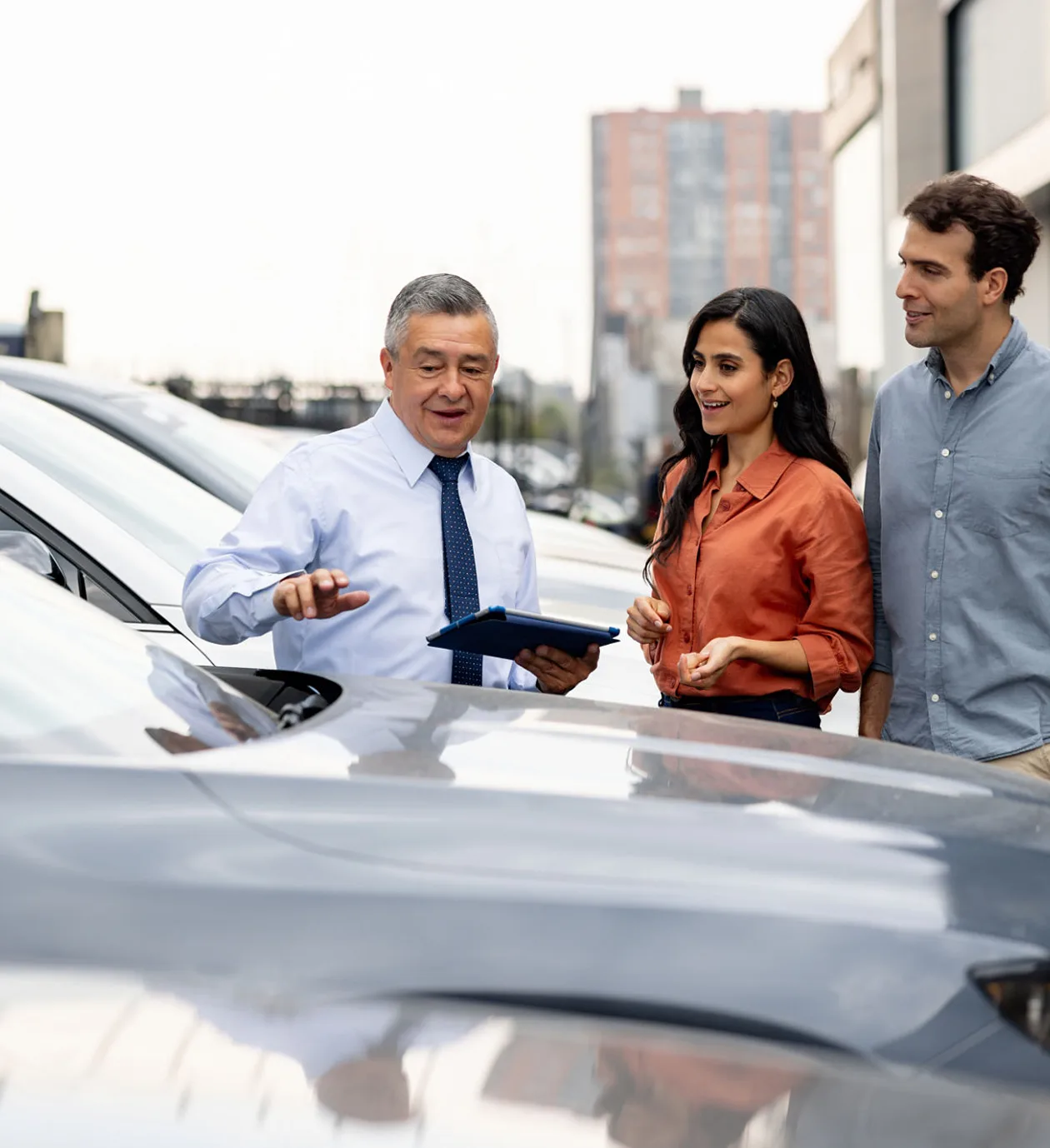 Salesperson explaining car features